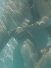 Kaylee and Silvie get hot and wet in the pool