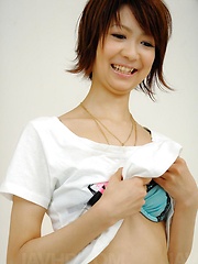 Perky Miriya Hazuki in green satin toyed with a vibrator