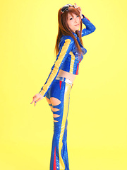 Minami Haduki Asian plays withlatex suit showing some curves