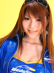 Minami Haduki Asian plays withlatex suit showing some curves