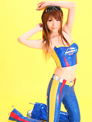 Minami Haduki Asian plays withlatex suit showing some curves