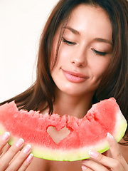 Mila M gets naughty and naked while eating a watermelon