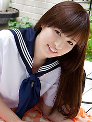 Maho Kimura Asian undresses school uniform right in the park
