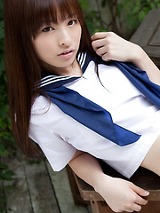 Maho Kimura Asian undresses school uniform right in the park