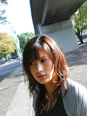 Sara Tsukigami Asian undresses and sits in naughty positions
