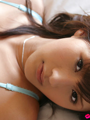Sara Tsukigami Asian undresses and sits in naughty positions