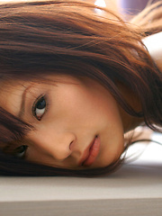 Sara Tsukigami Asian undresses and sits in naughty positions